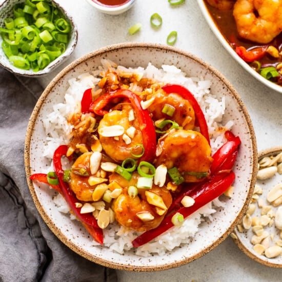 kung pao shrimp with white rice in bowl.