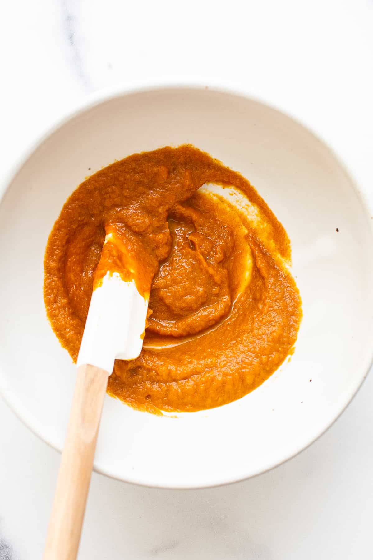 Pumpkin filling in a bowl.