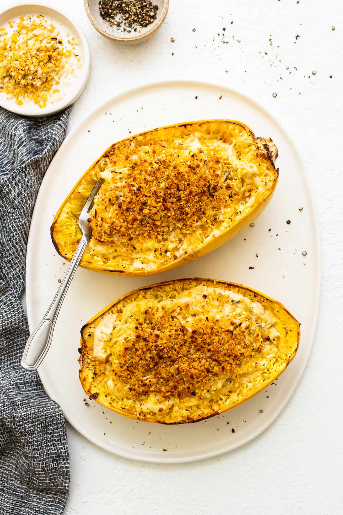Spaghetti squash mac and cheese topped with breadcrumbs.