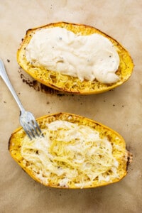 Two squash boats with a fork on top.