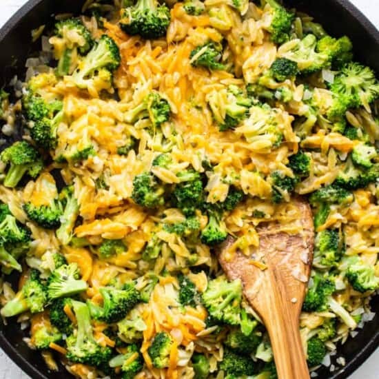 broccoli and cheese casserole in cast iron skillet.