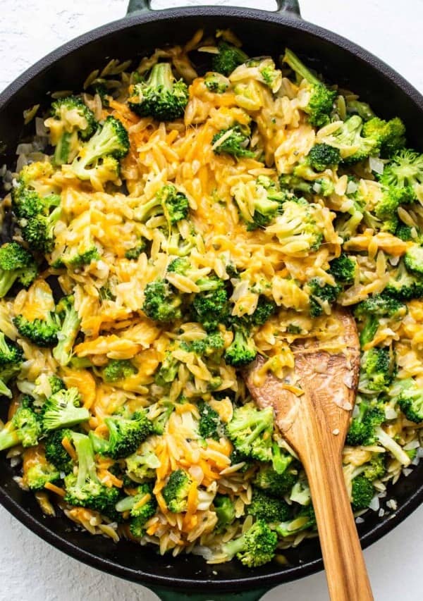 broccoli and cheese casserole in cast iron skillet.