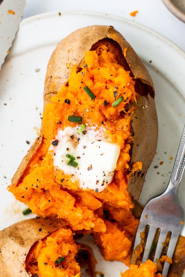 Sweet potatoes on a plate with a fork.