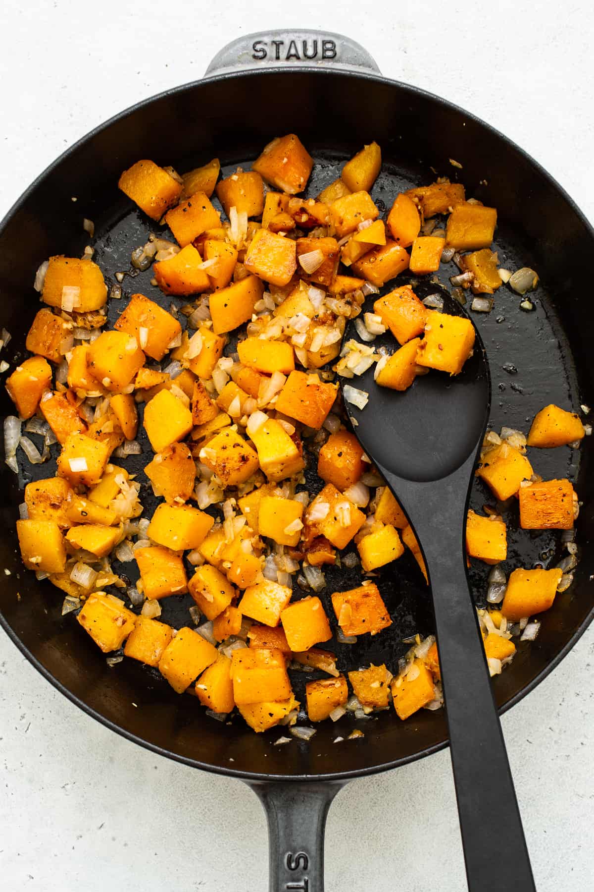 Butternut squash cooking in a pan. 