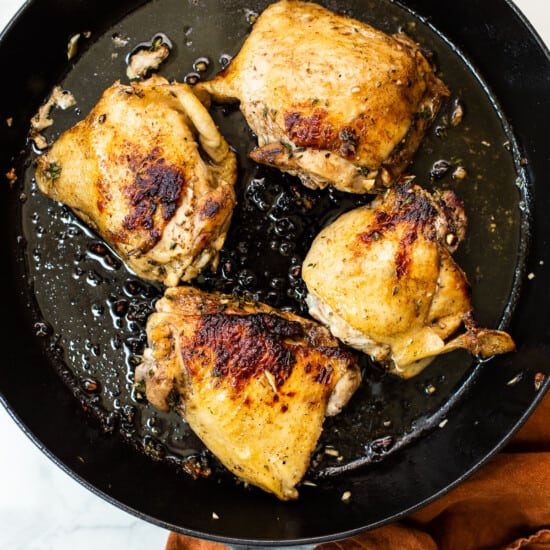 Browning chicken in a skillet.