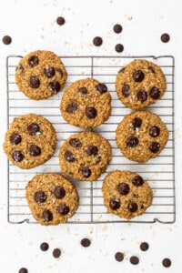 Chocolate chip cookies on a cooling rack.