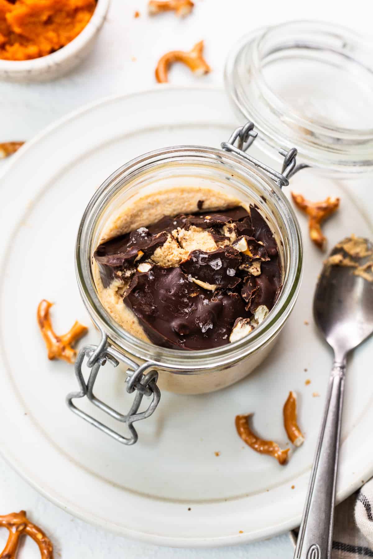Pumpkin mousse in a jar with chocolate topping.