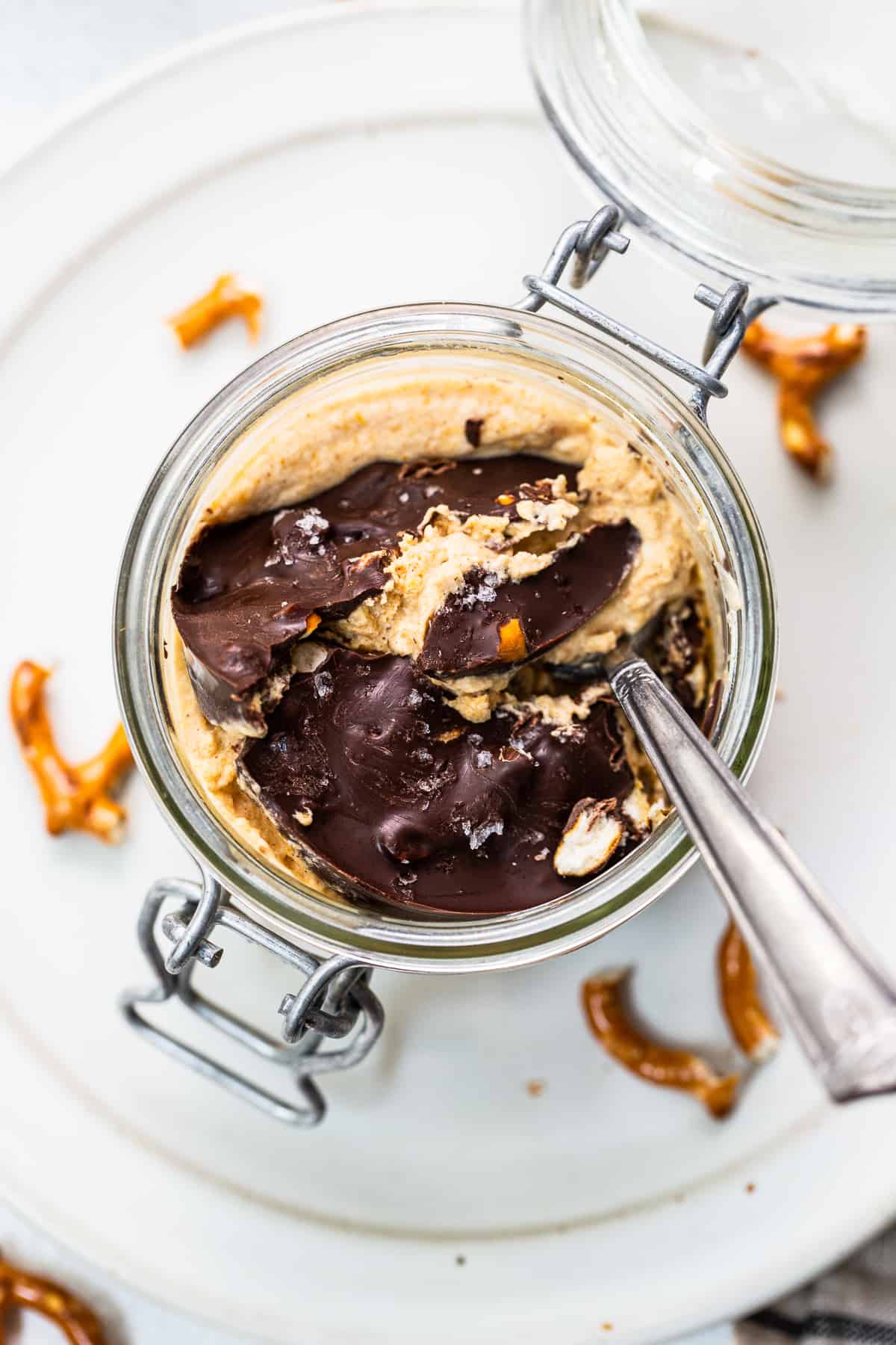 Pumpkin mousse in a jar topped with chocolate topping.