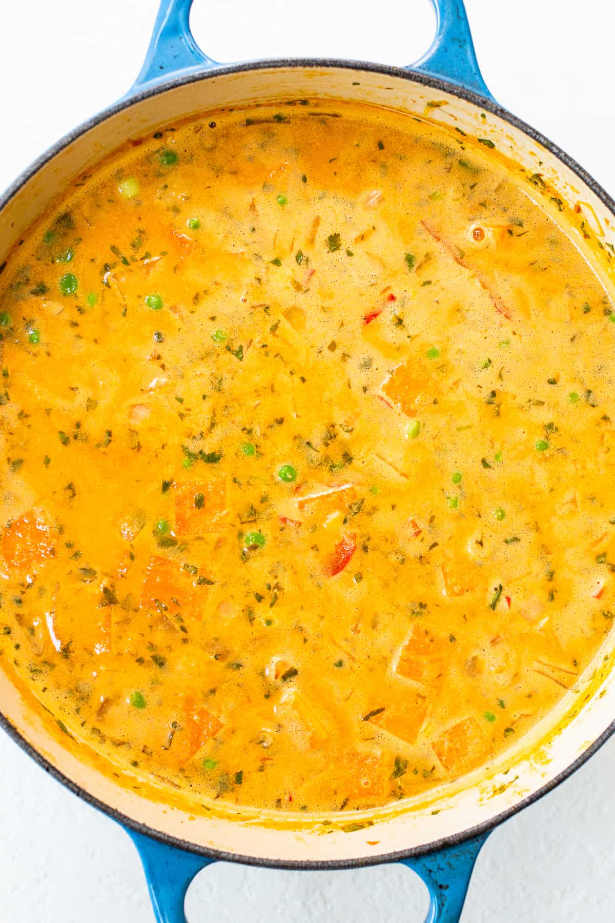 A bowl of soup in a blue pot.