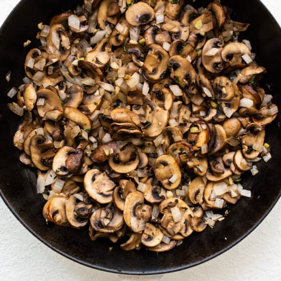 cooking mushrooms in pan.
