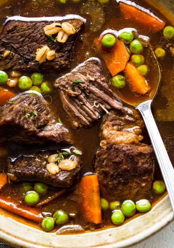 a bowl of beef barley soup