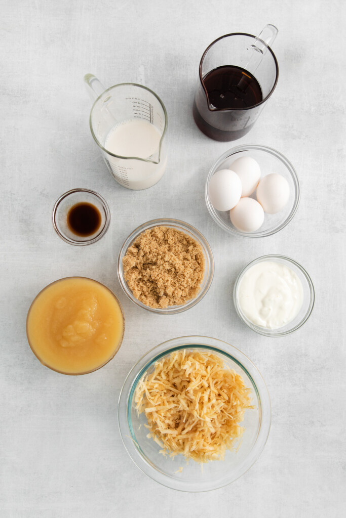 Ingredients for apple cake in small bowls.