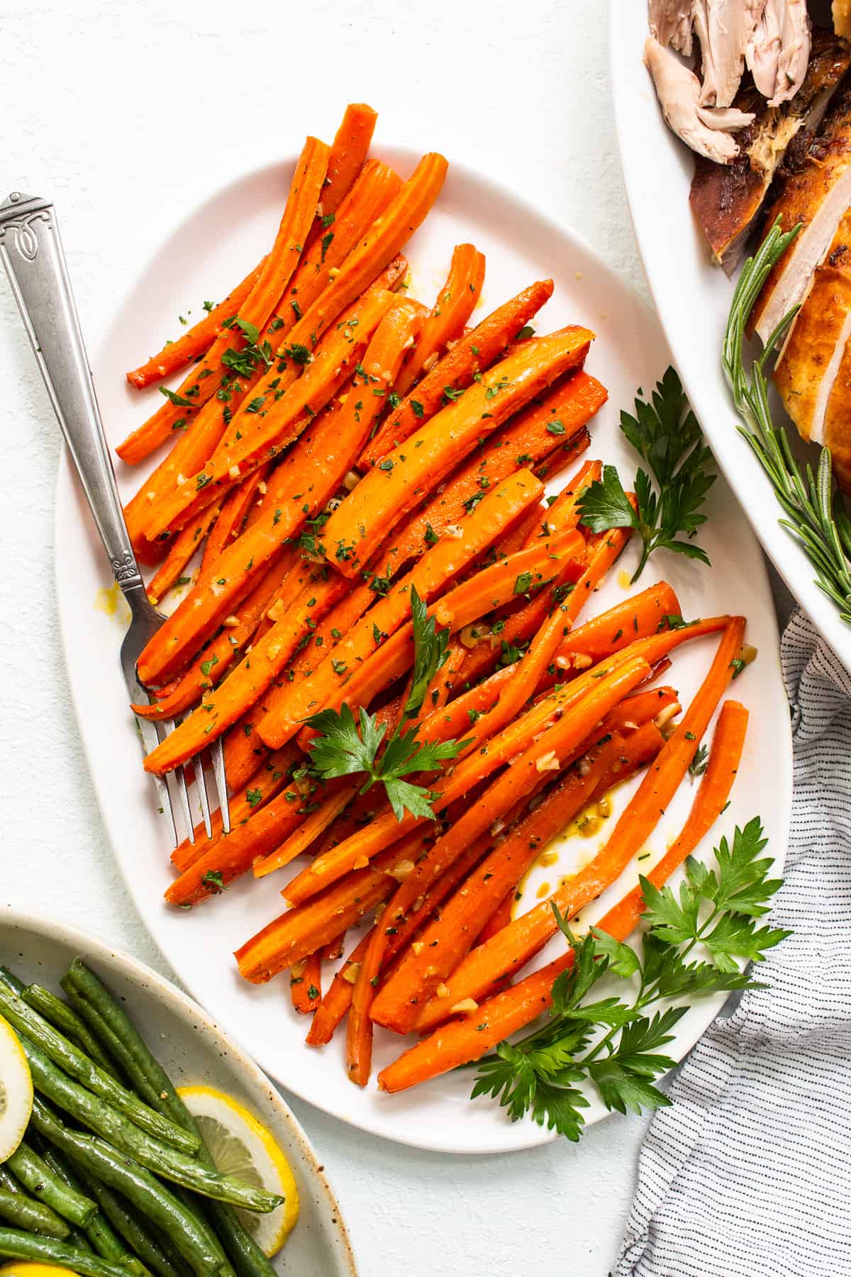 Garlic glazed carrots on a plate.