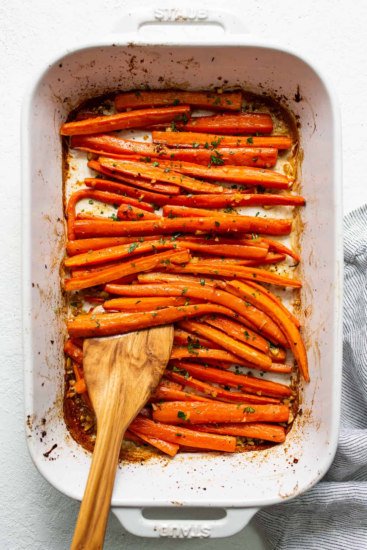 Garlic glazed carrots in a casserole dish.