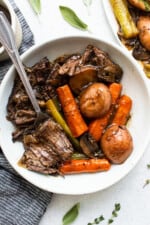 Pot roast in a bowl with a fork.