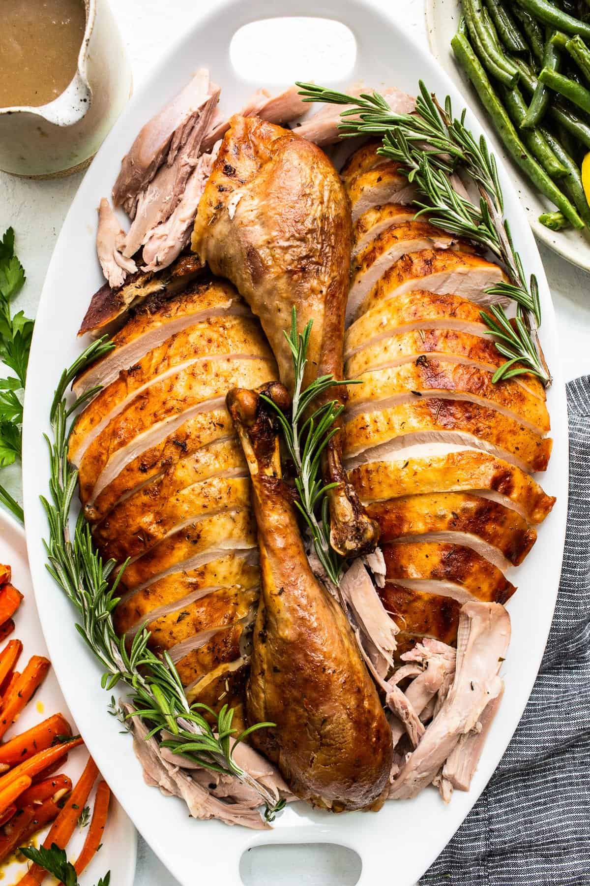 Thanksgiving turkey sliced and served on a platter. 