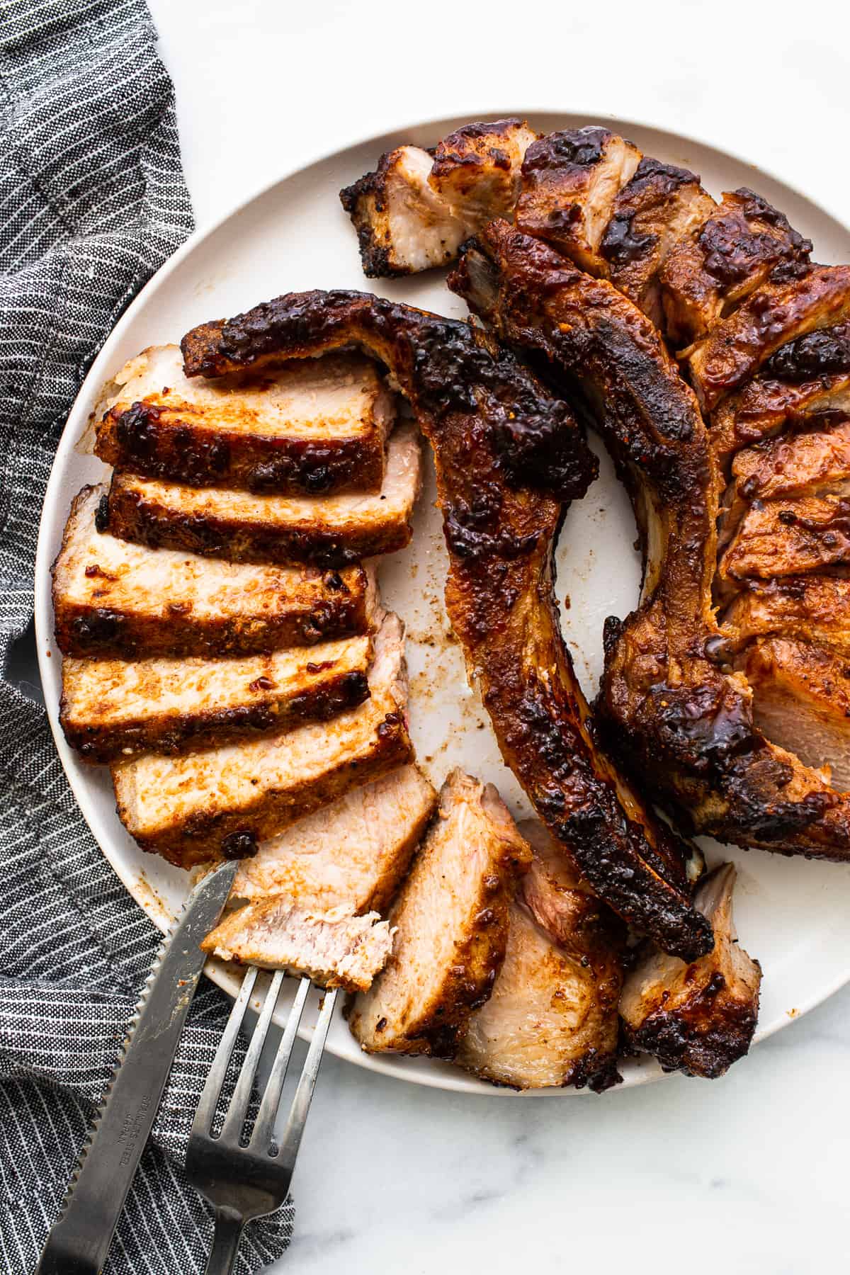 Sliced pork chops on a plate.