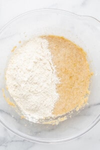 Two bowls of flour and sugar in a glass bowl.