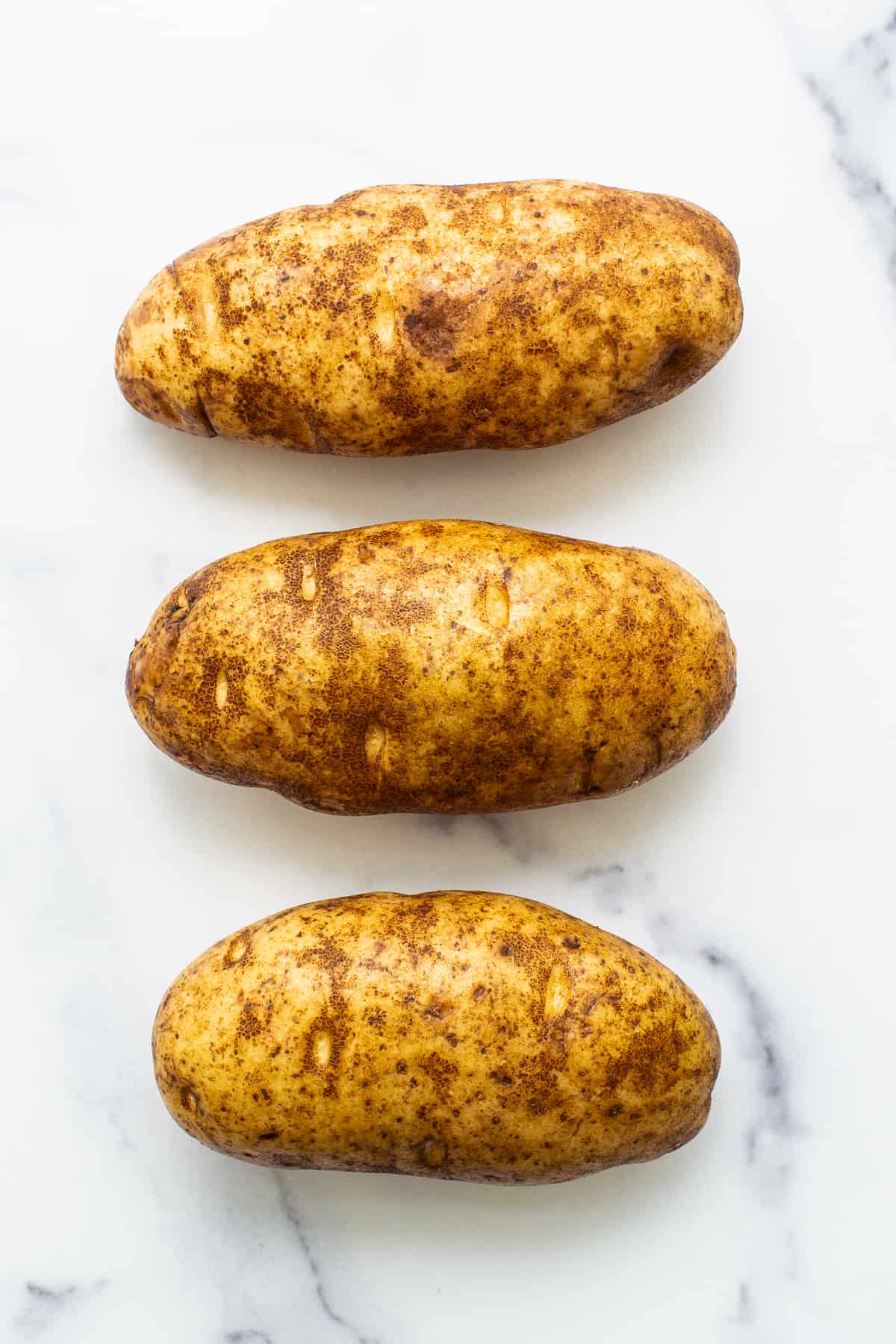 Potatoes on a counter top. 
