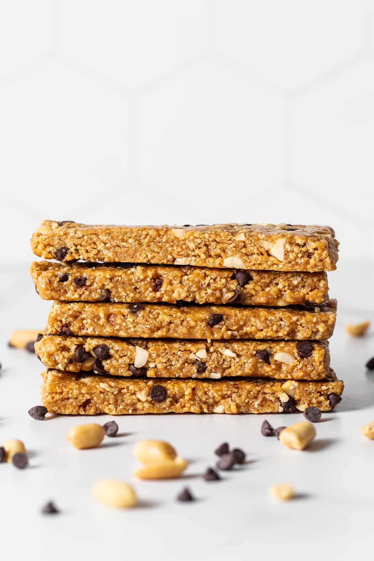 No bake peanut butter bars stacked on a plate.