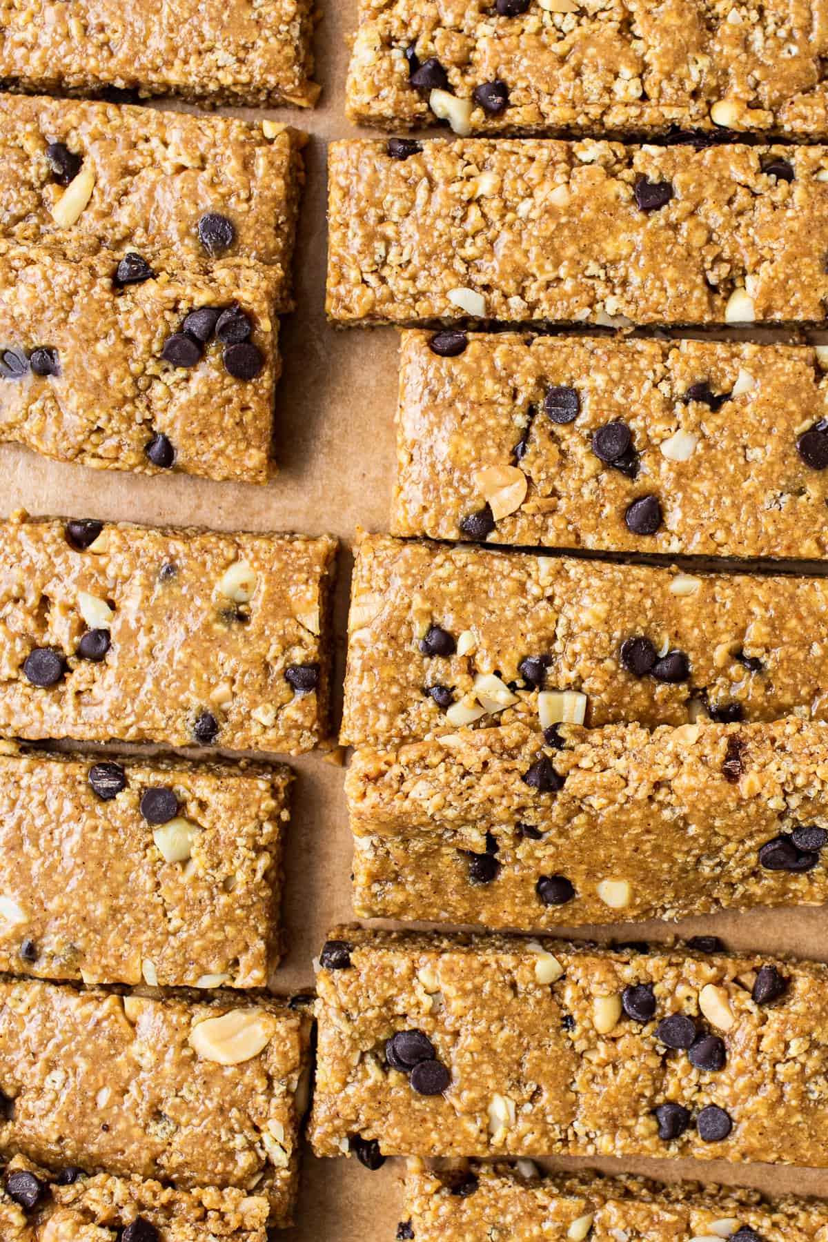 No bake peanut butter bars cut on parchment paper.