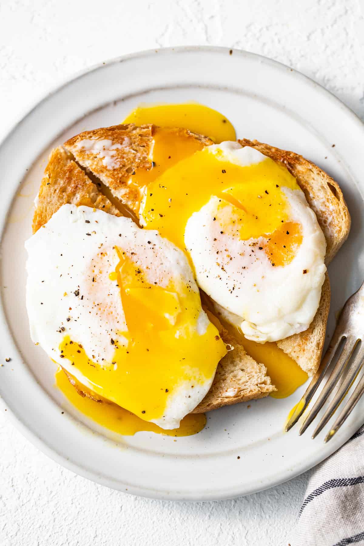 Over easy eggs served over toast.
