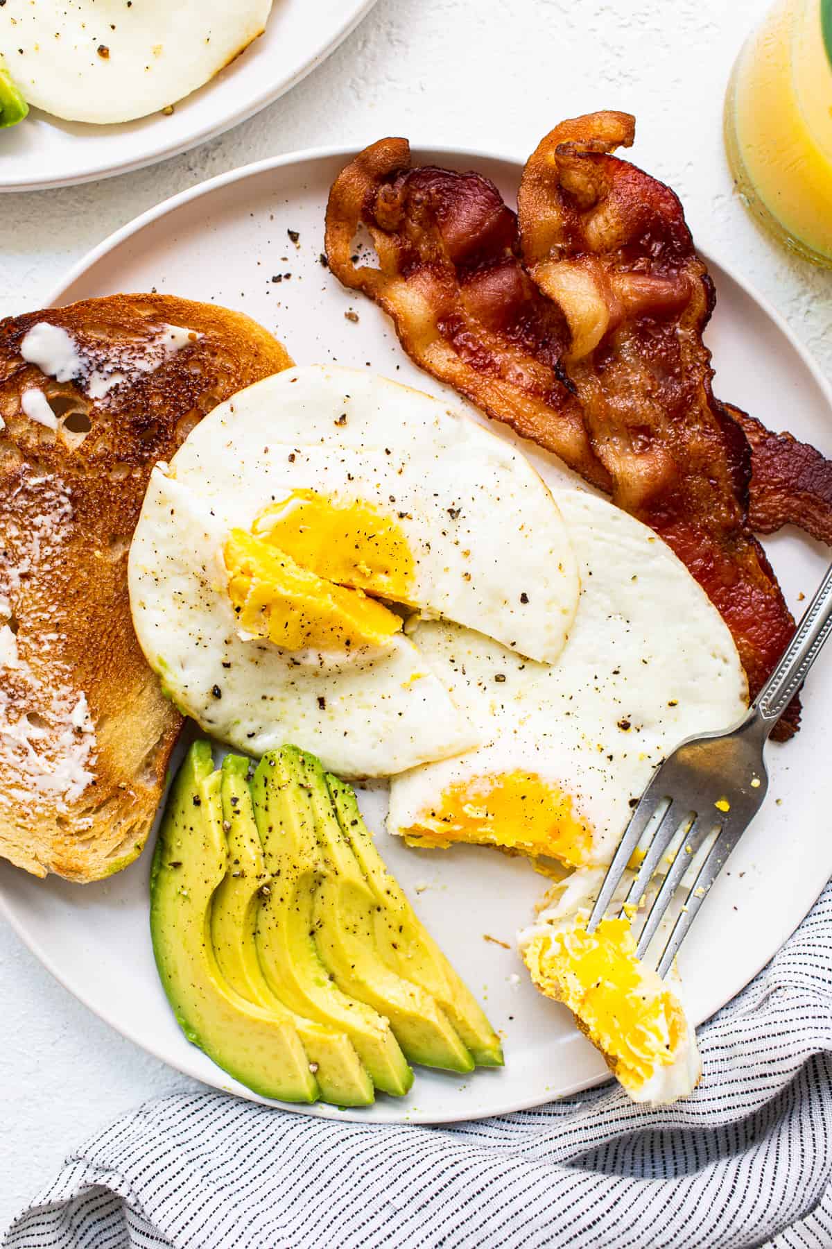 fried eggs on a plate without the plate