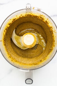 Creamy pistachio butter in a food processor.