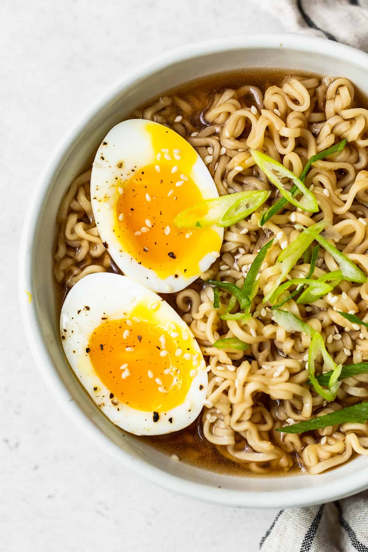 Soft boiled eggs in a bowl of ramen.