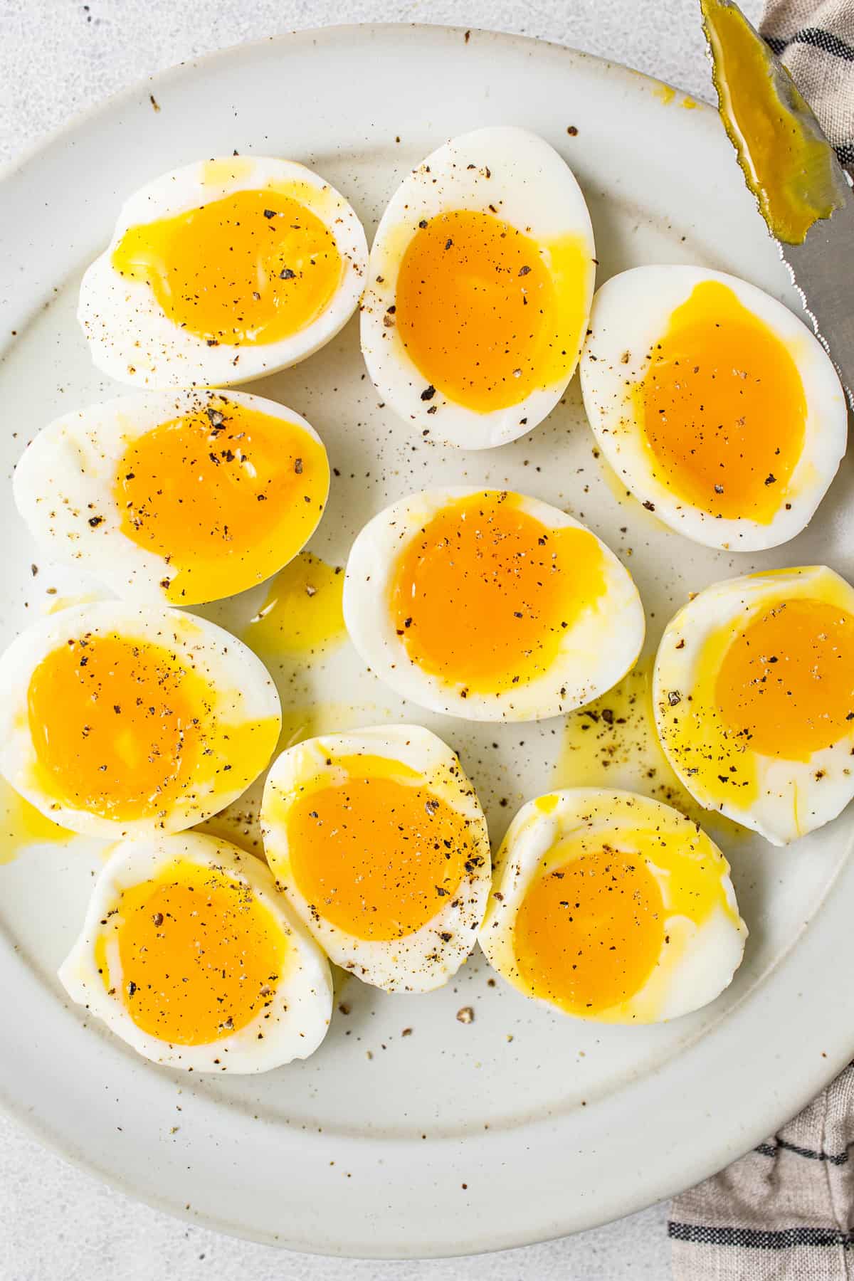 Soft boiled eggs on a plate.
