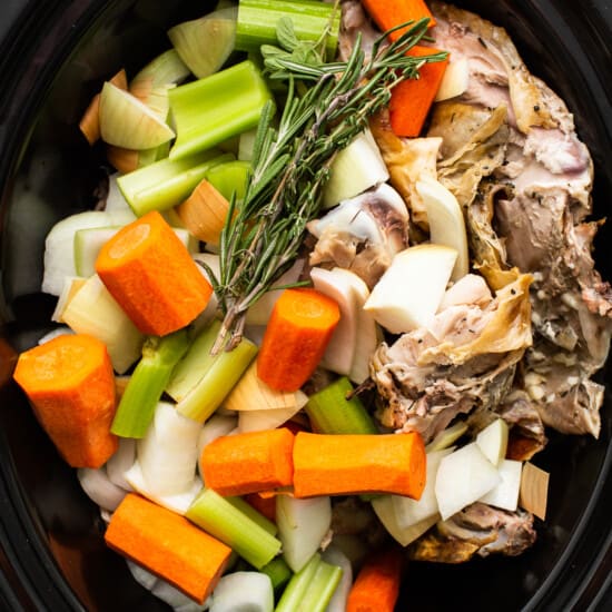 Vegetables and turkey in a slow cooker.