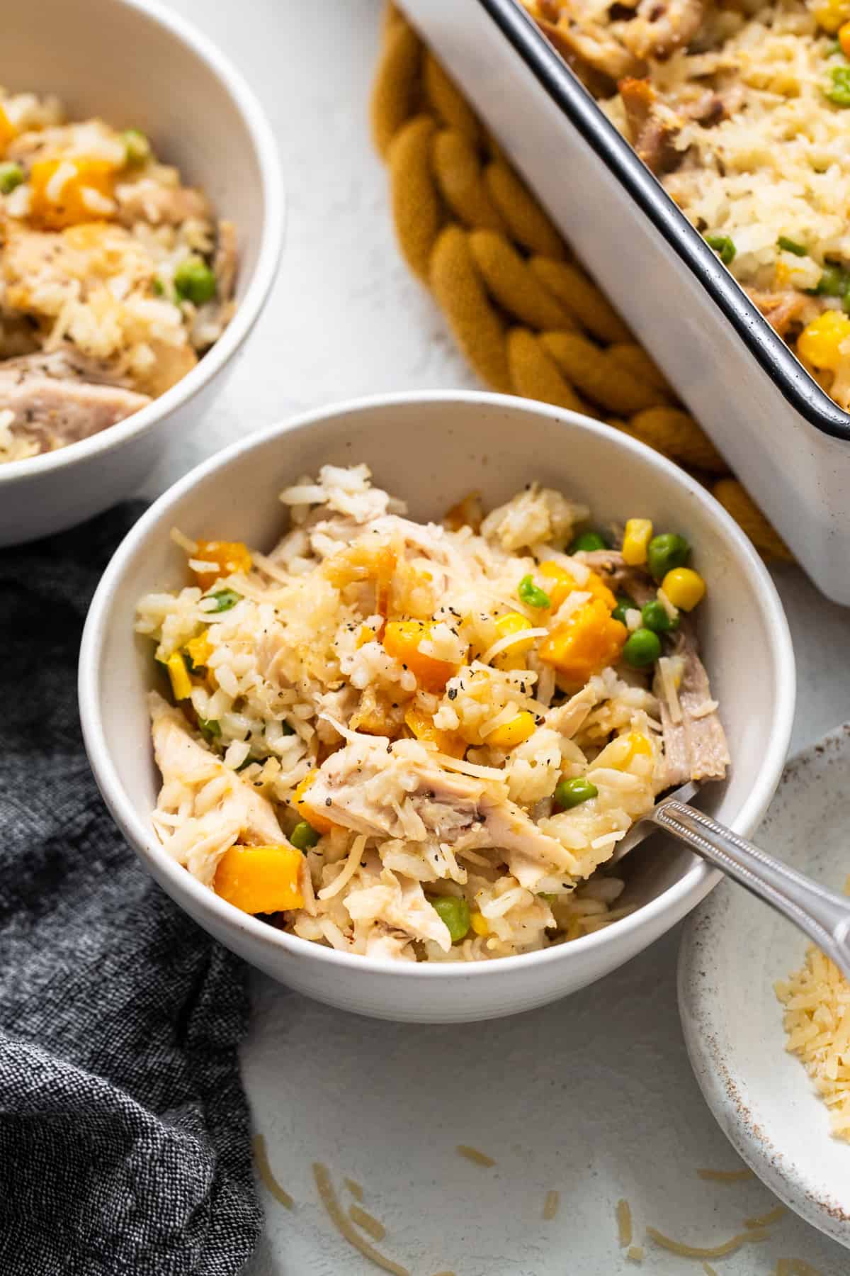 Turkey casserole in a bowl with a spoon.