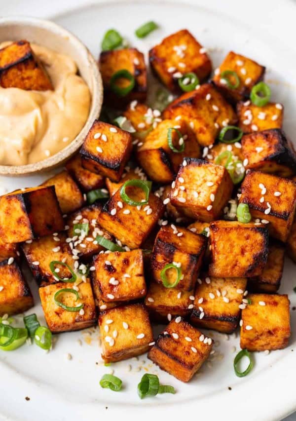 air fryer tofu on a plate with dipping sauce