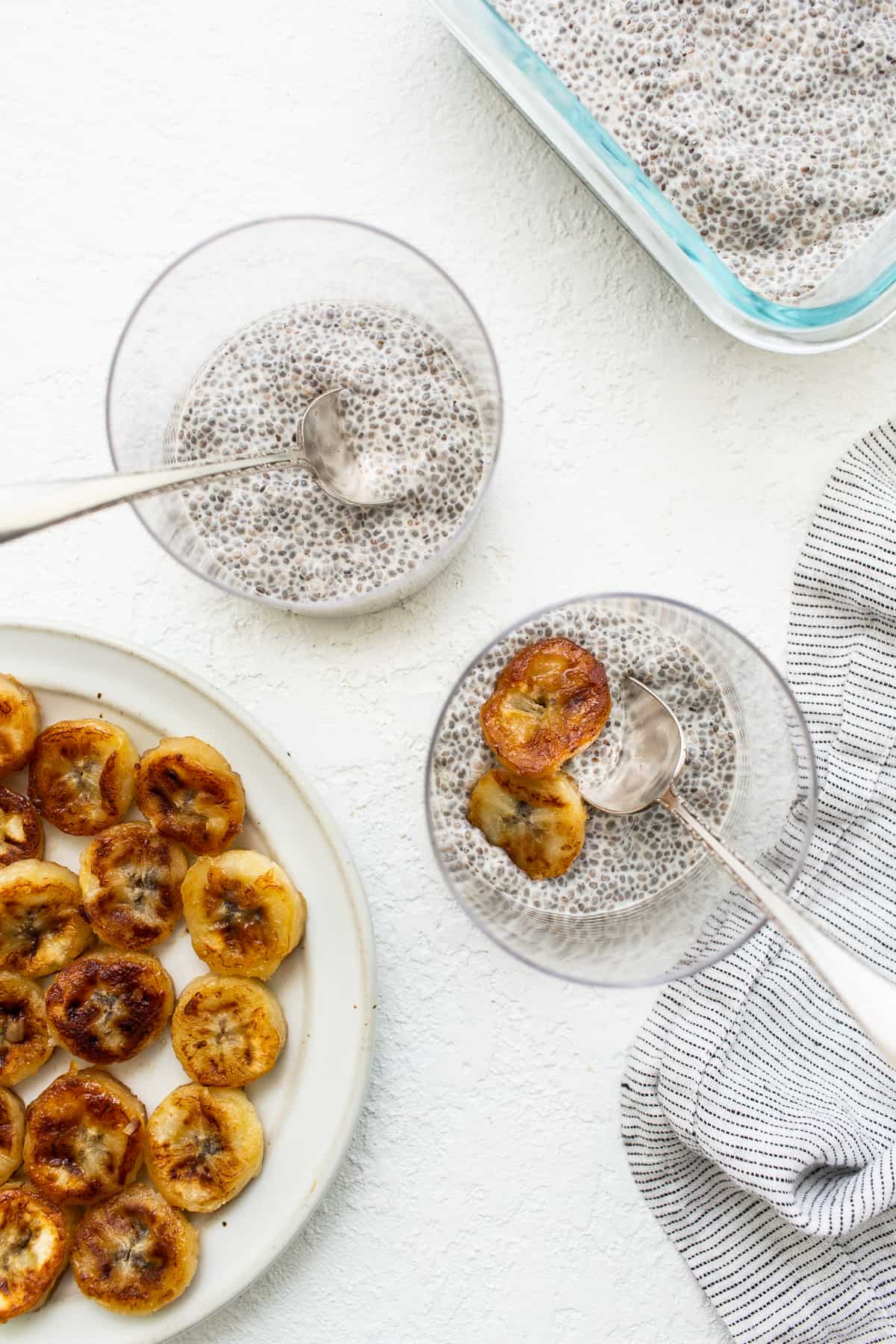 Chia seed pudding in glasses topped with caramelized bananas.