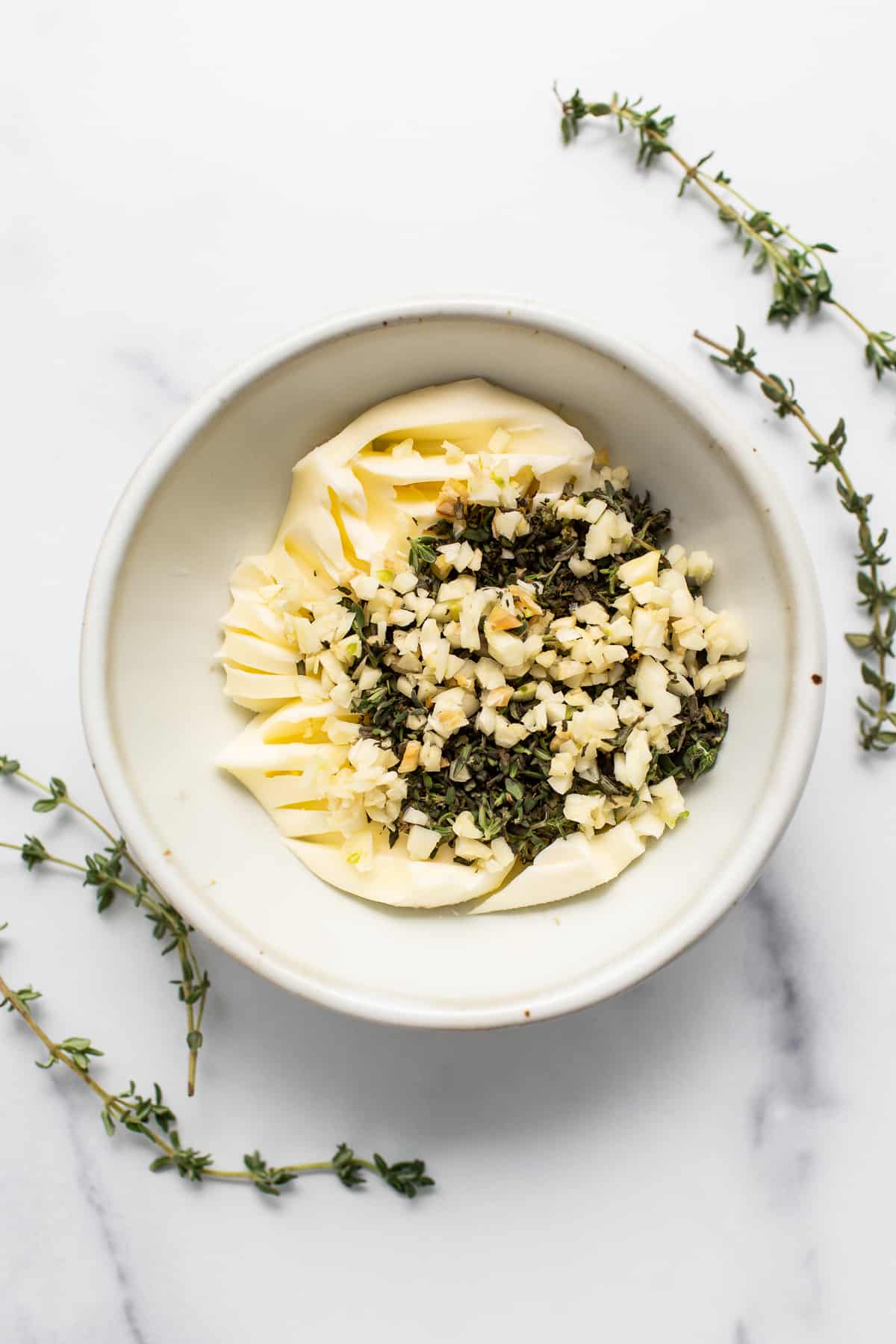 Garlic butter and herbs in a bowl. 
