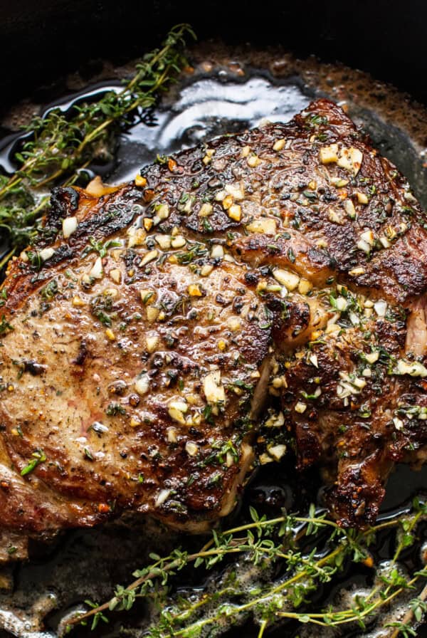 Cast iron steak in a pan.