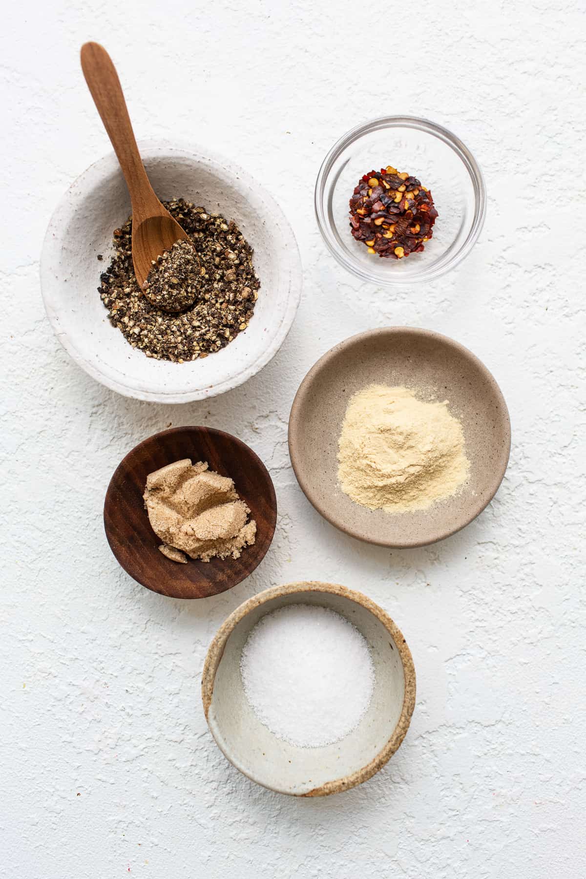 Steak seasoning ingredients in bowls.