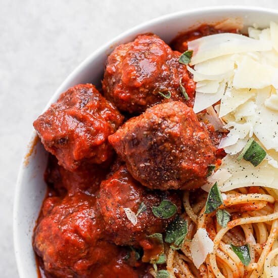 meatballs in bowl with parmesan cheese.