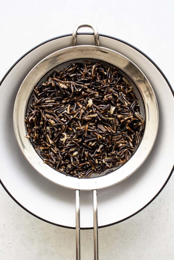 Black tea on a white surface.
