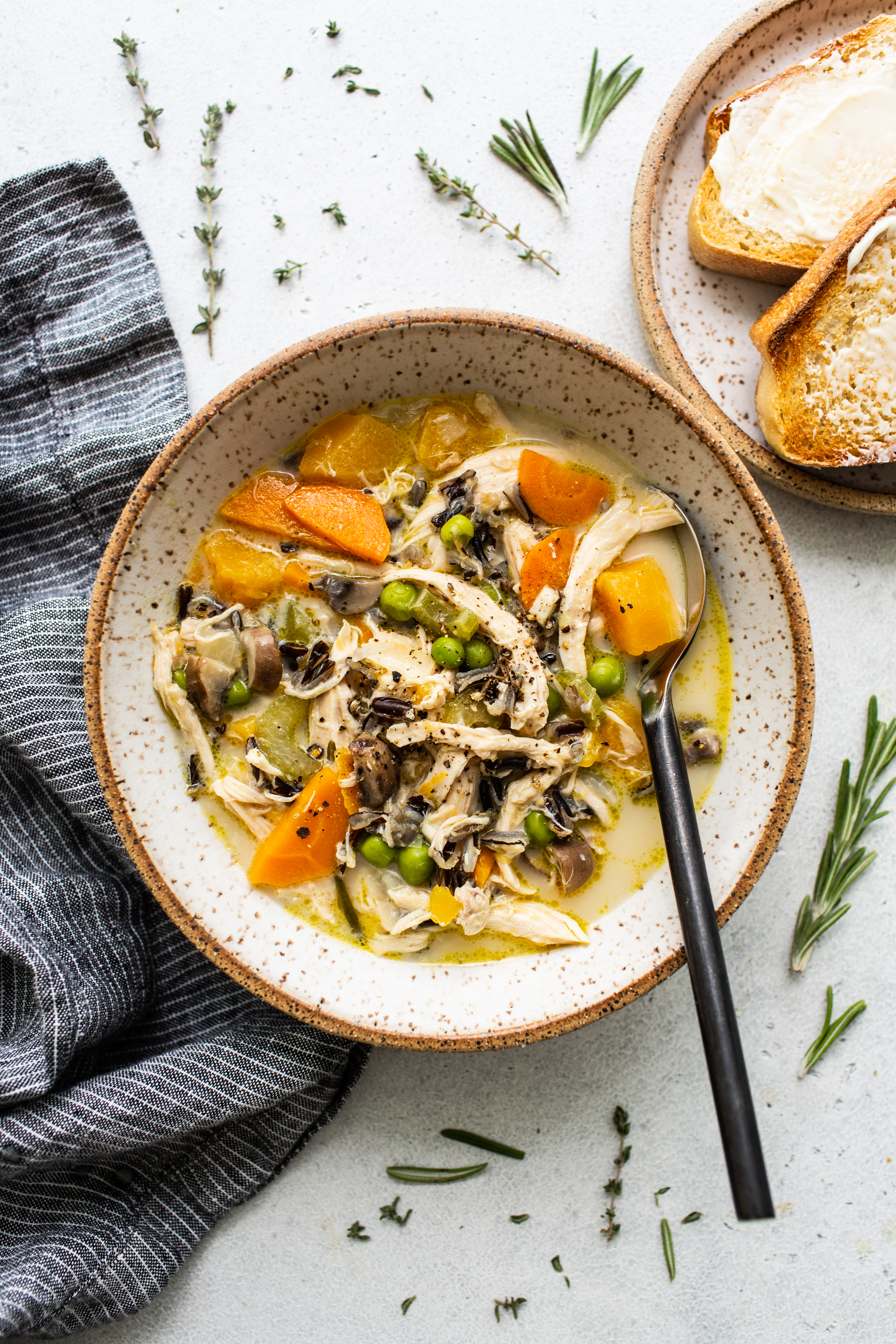 Turkey wild rice soup in a bowl with a spoon.