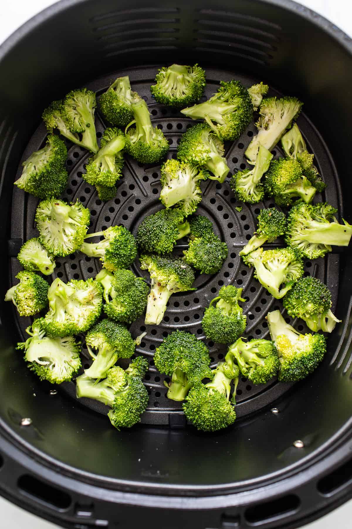 Broccoli florets in the air fryer.
