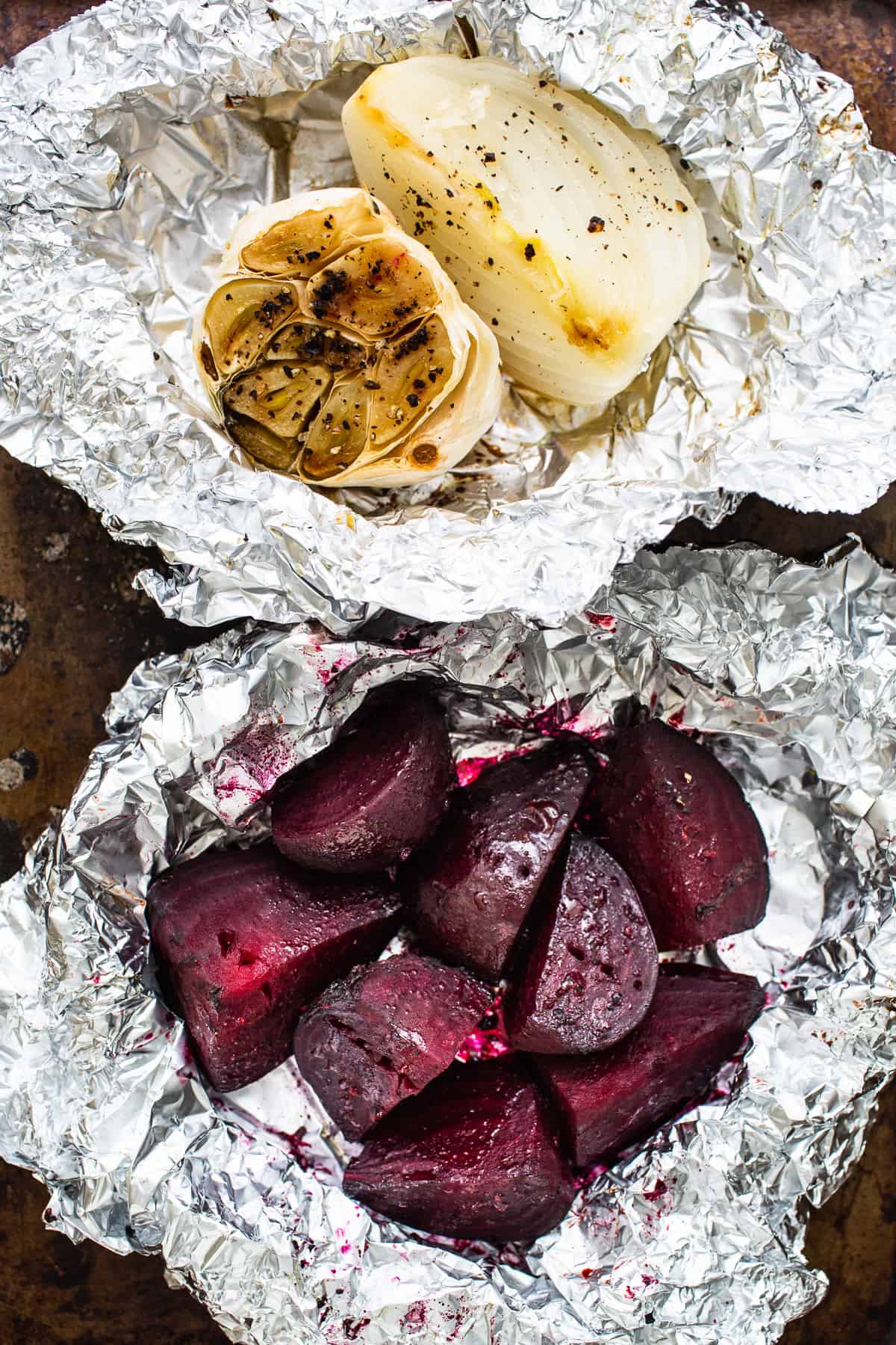 Roasted beets and onion in tin foil.