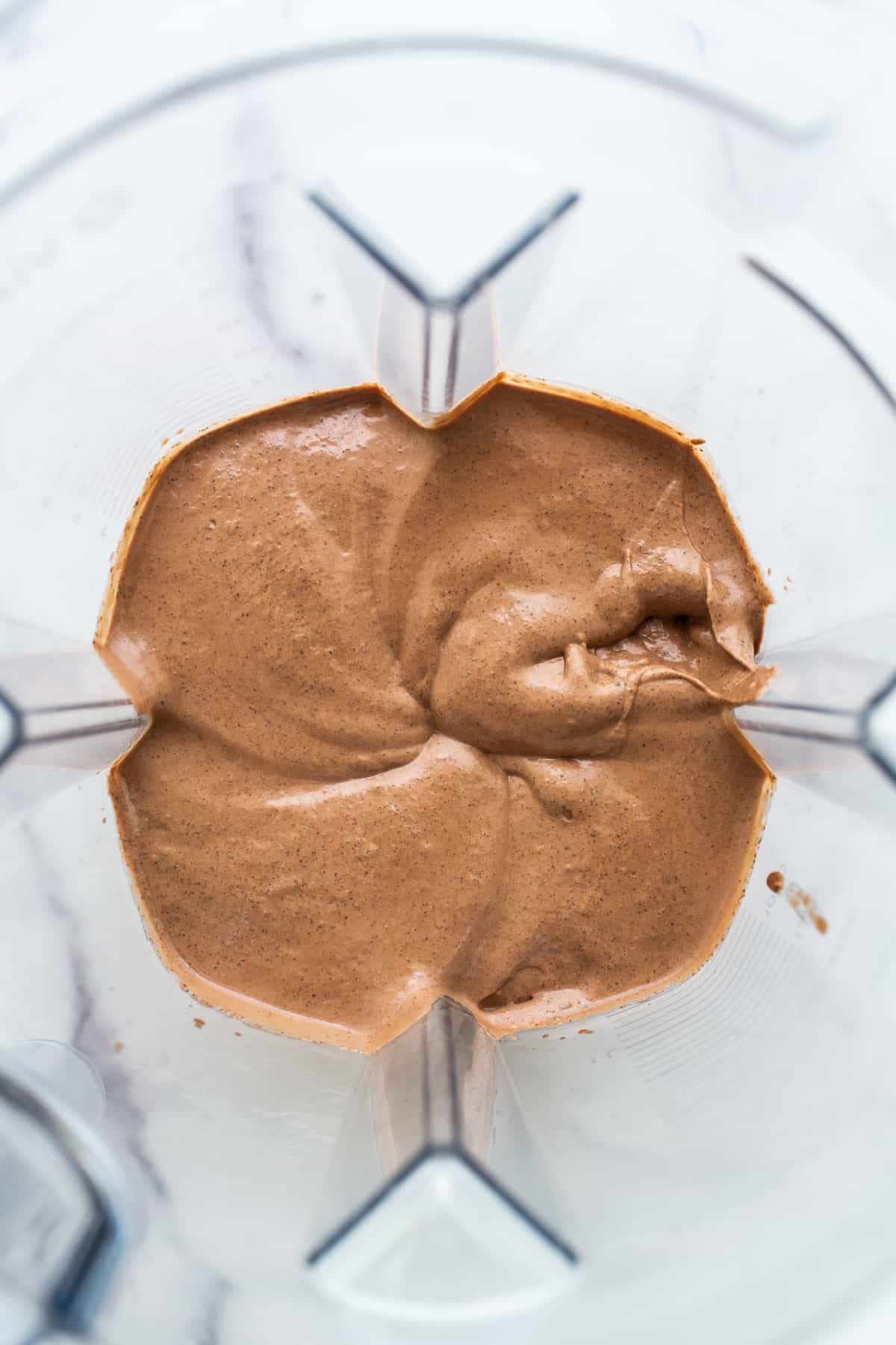 Blended chia seed pudding in a blender.