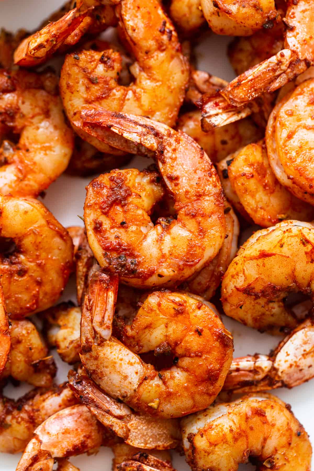 Stacked broiled shrimp.