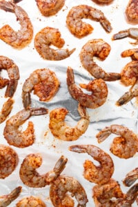 Shrimp on a sheet of aluminum foil.