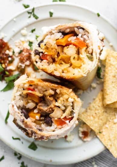 Chicken fajita burrito on a plate.