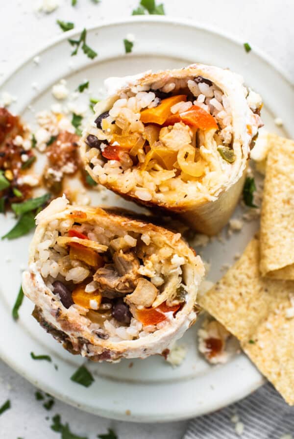 Chicken fajita burrito on a plate.