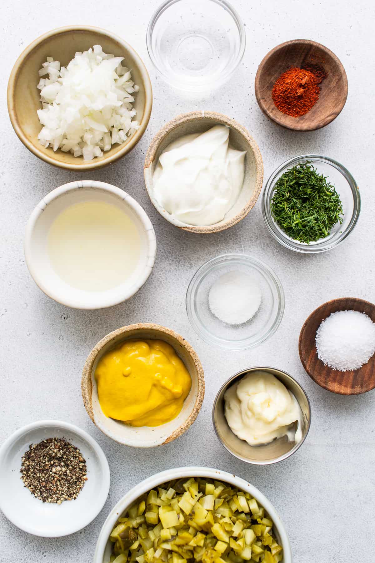 Ingredients for deviled egg salad in bowls.