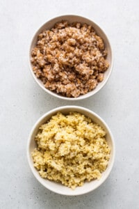 Two bowls of quinoa and brown rice.