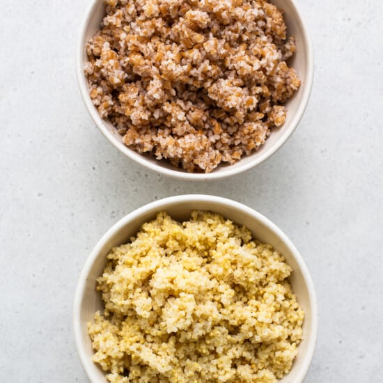 Two bowls of quinoa and brown rice.